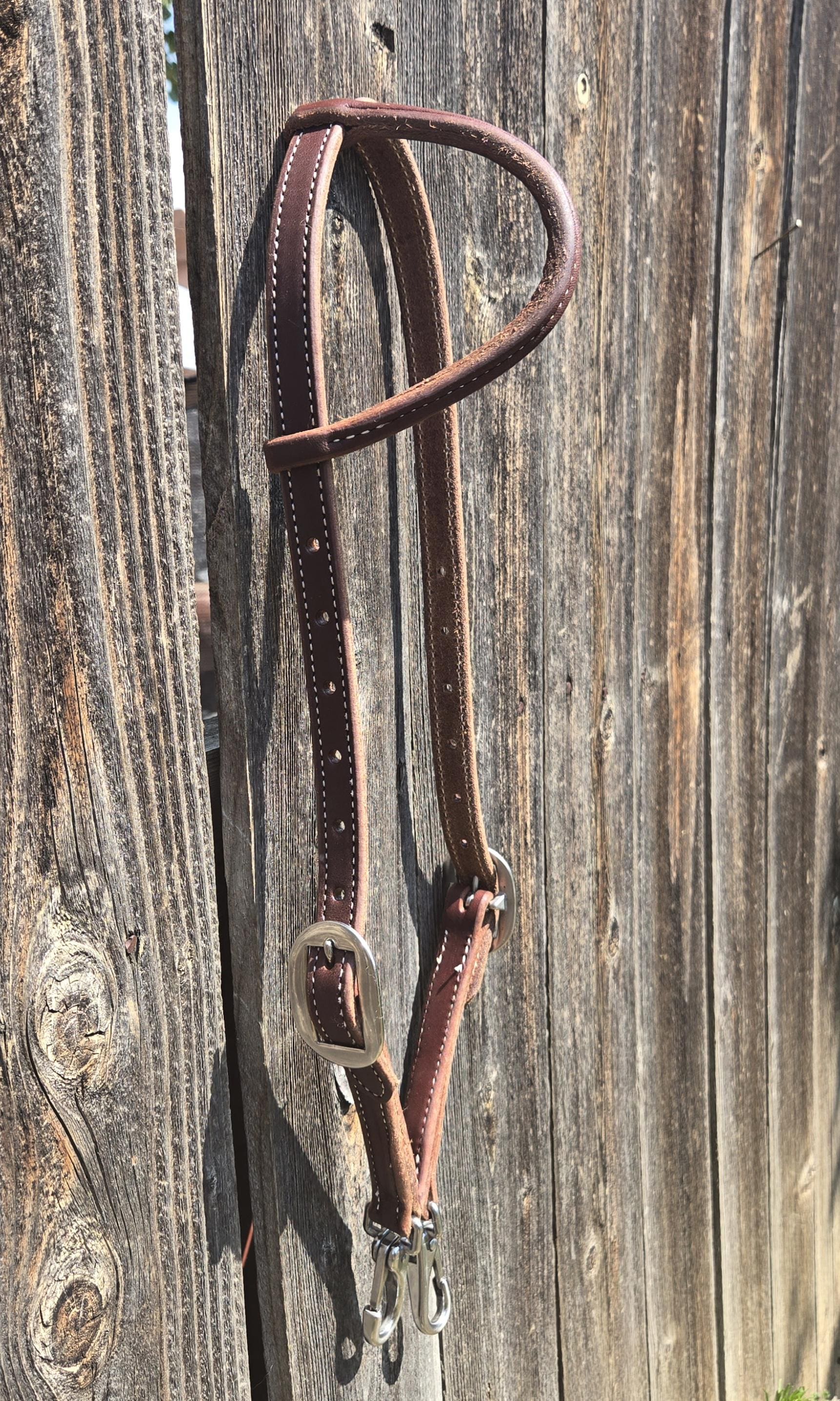 One ear headstall with quick change snap ends, butter soft leather, stainless steel hardware, standard horse size