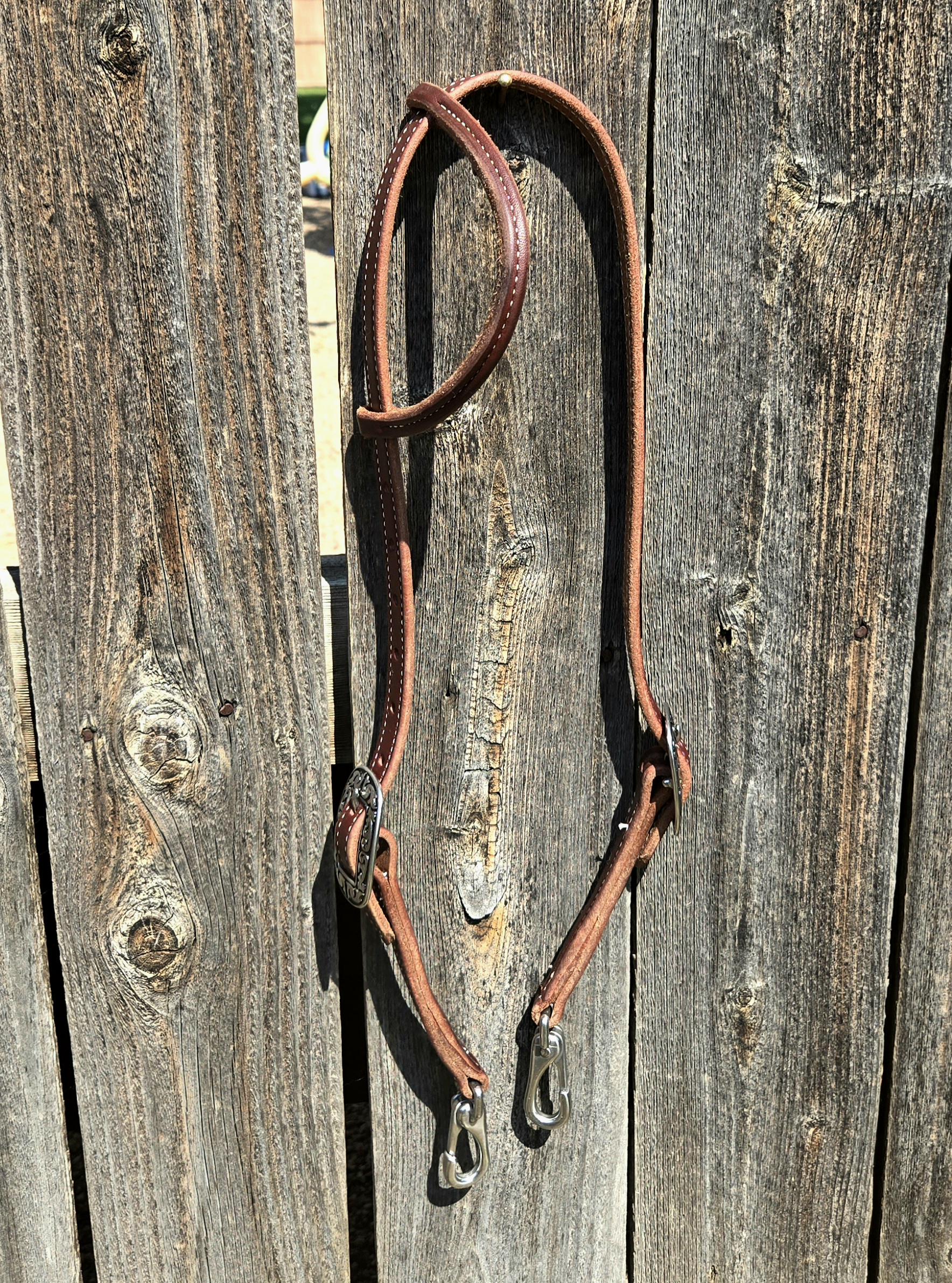 One ear headstall with quick change snap ends, butter soft leather, stainless steel hardware, standard horse size
