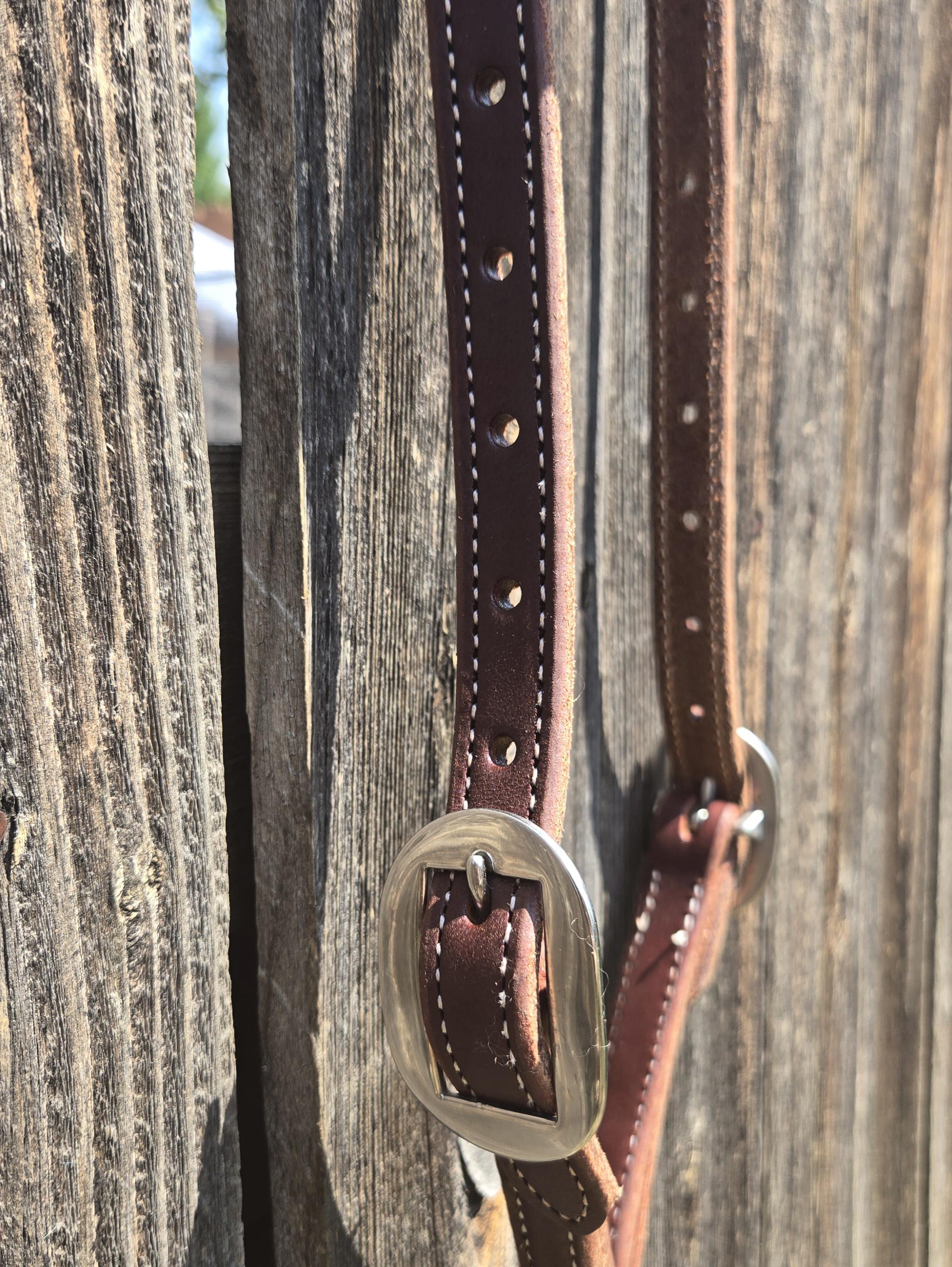 One ear headstall with quick change snap ends, butter soft leather, stainless steel hardware, standard horse size