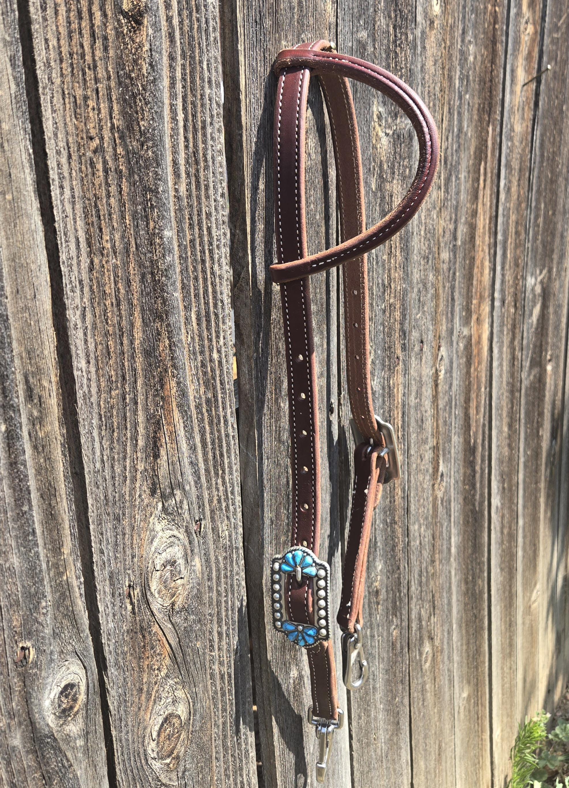 One ear headstall with quick change snap ends, butter soft leather, stainless steel hardware, standard horse size